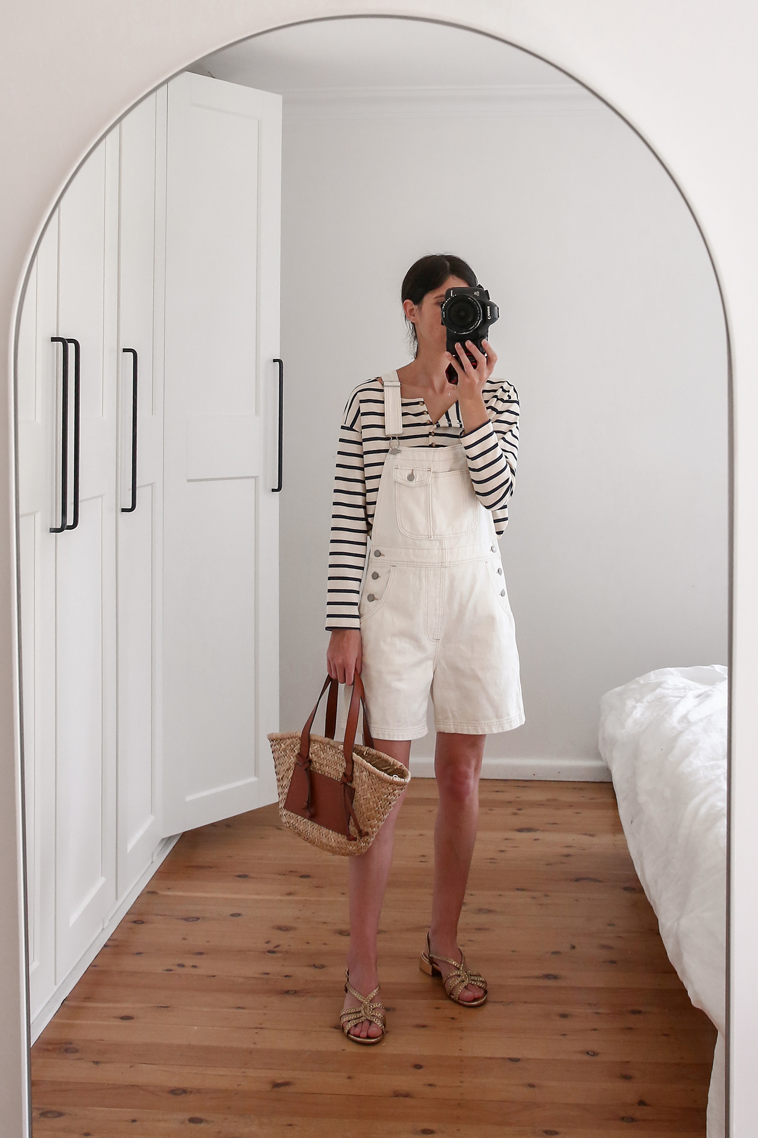 Minimal Style Outfit wearing Levis Shortalls and a striped top