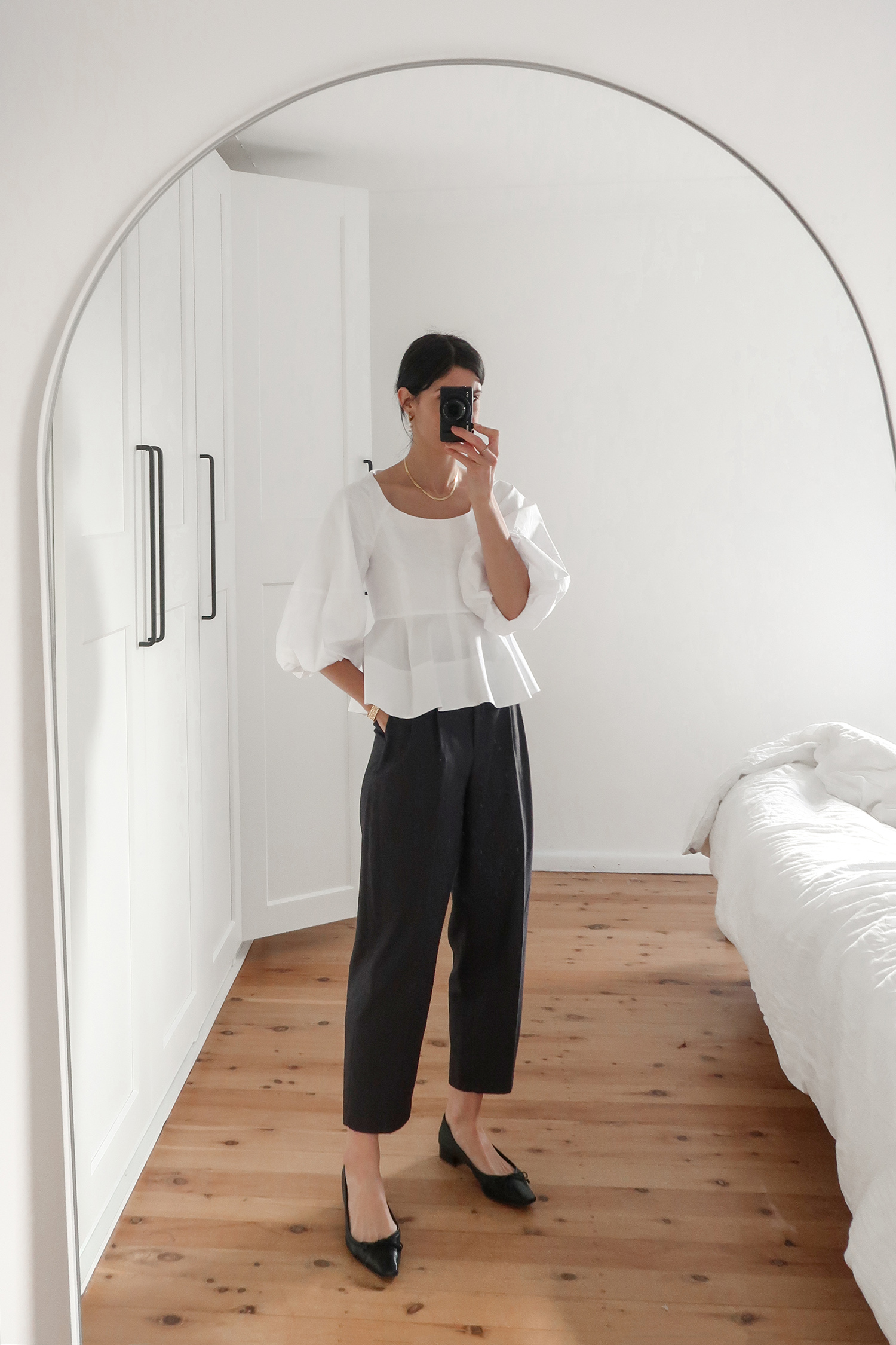 Tibi white peplum top worn with H&M trousers