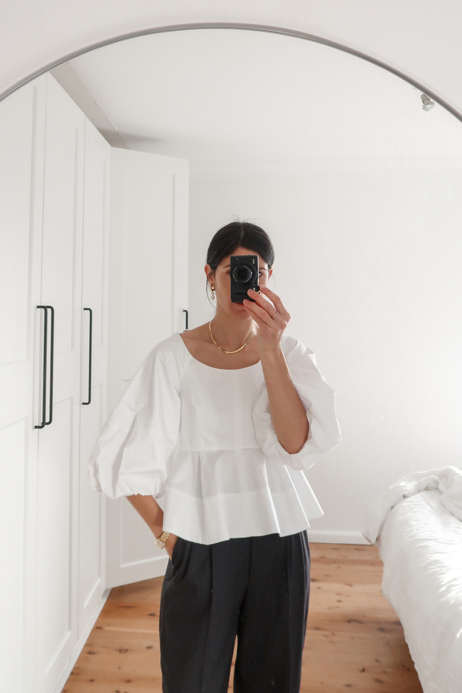 Tibi white peplum top worn with H&M trousers