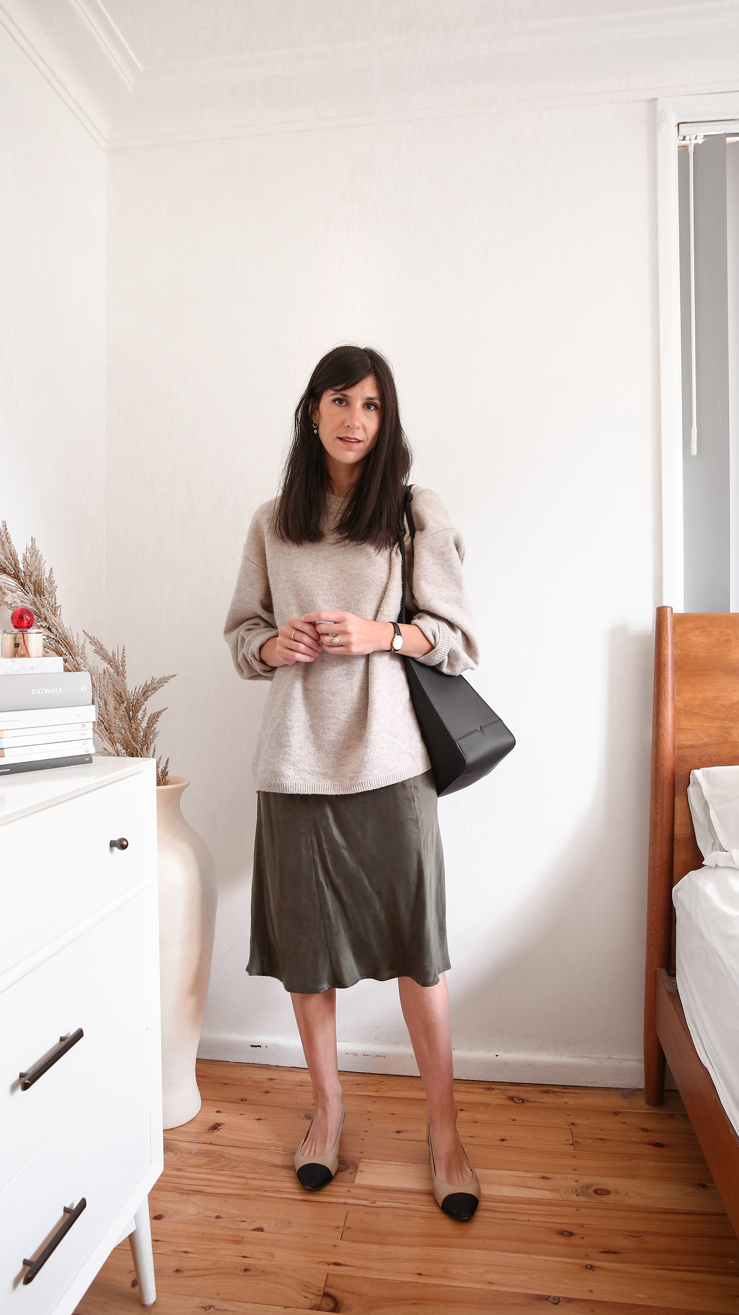 Parisian Chic Style wearing Oversized Knit with a slinky St Agni slip dress