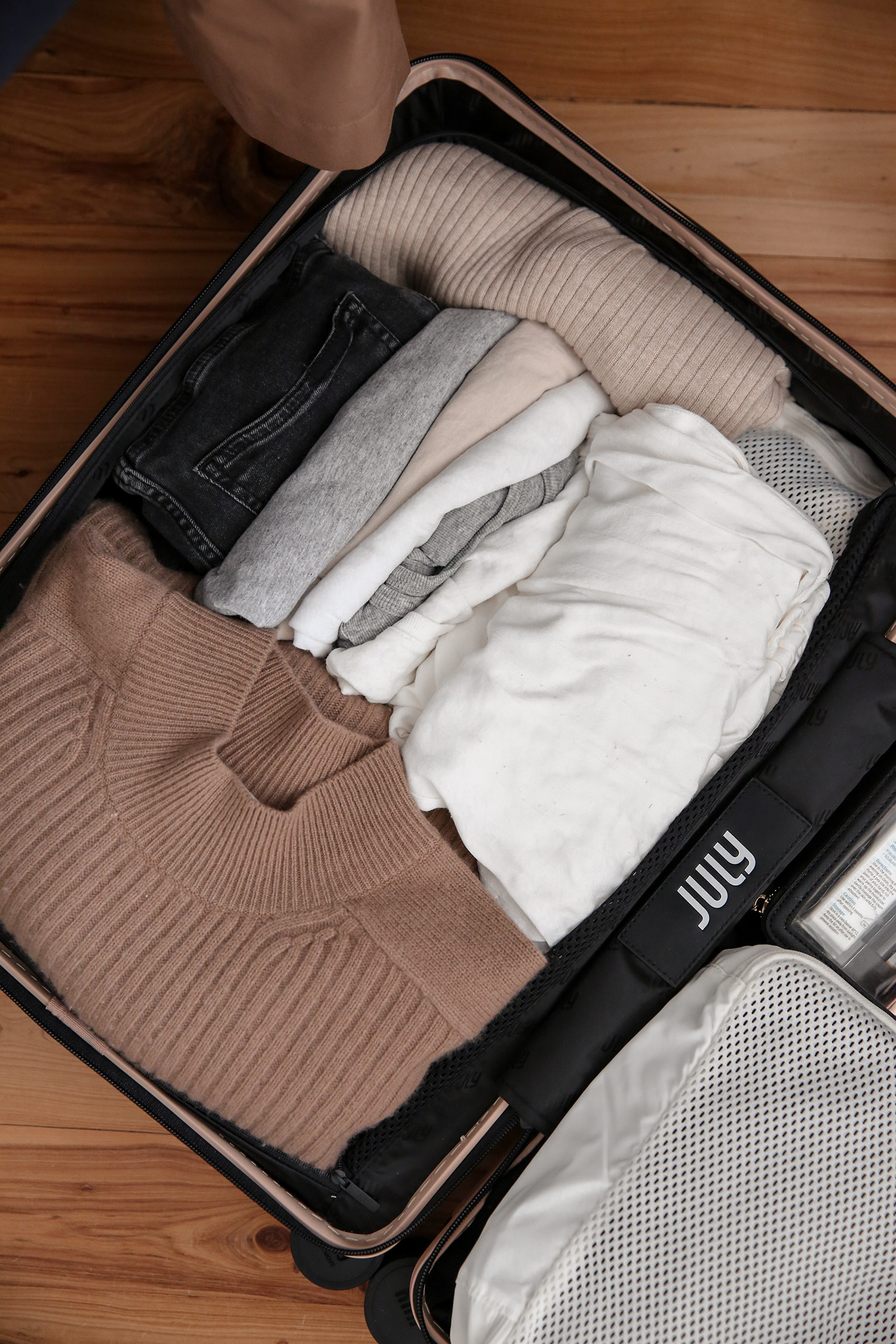 What fits inside July Carry on Suitcase