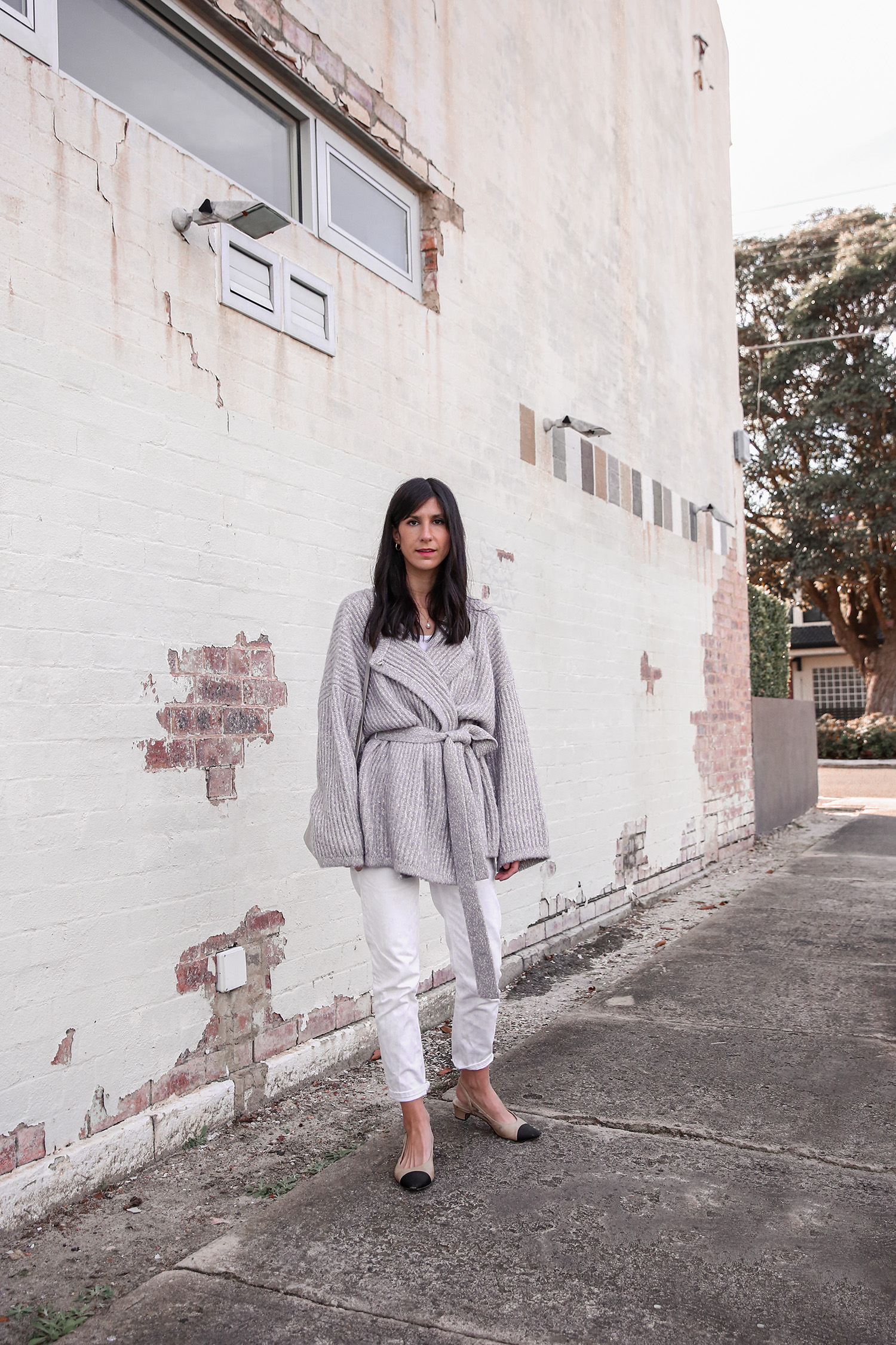 Neutral minimal style outfit with straight leg jeans and chunky knit