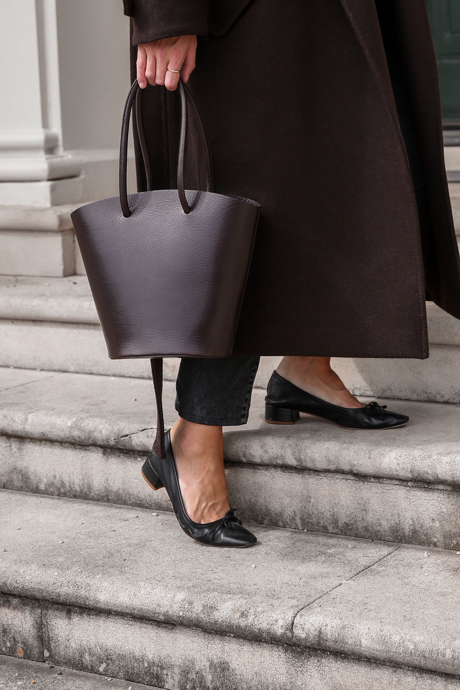 Minimal Outfit wearing chocolate brown tones in Low Classic coat