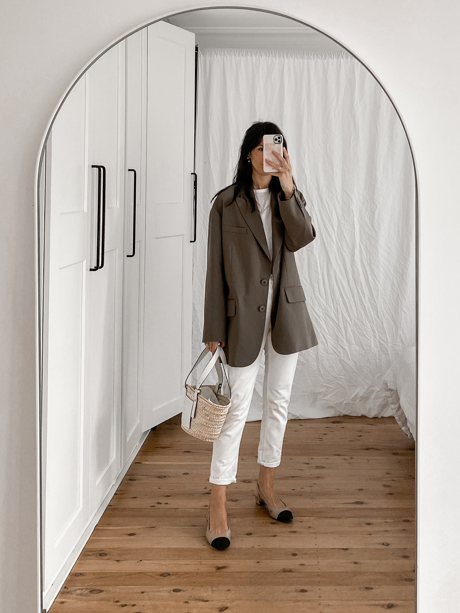 Minimal neutral outfit wearing Everlane 90s cheeky straight jeans and Tibi Liam blazer