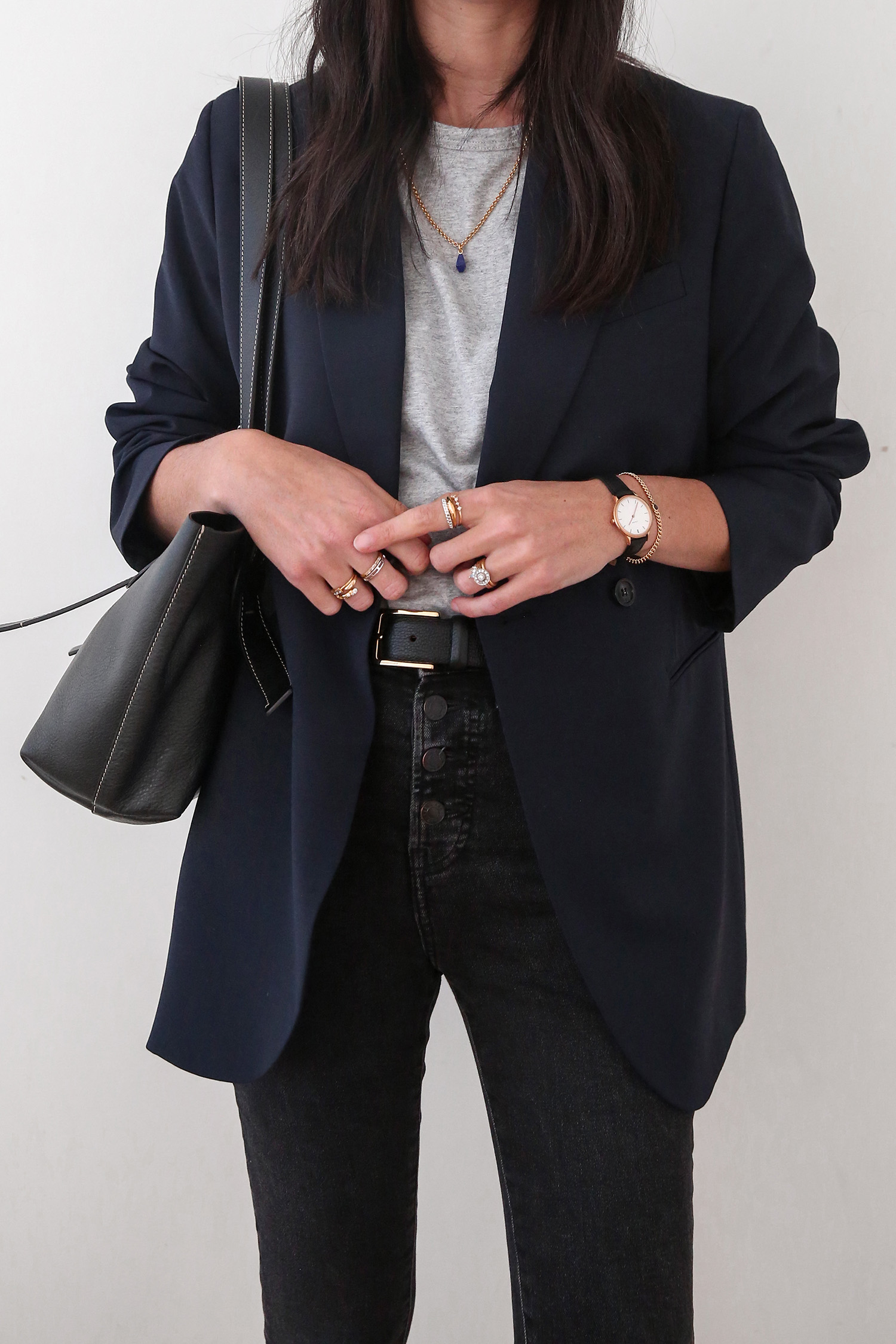Scandi chic style wearing grey tee with navy blazer and skinny jeans