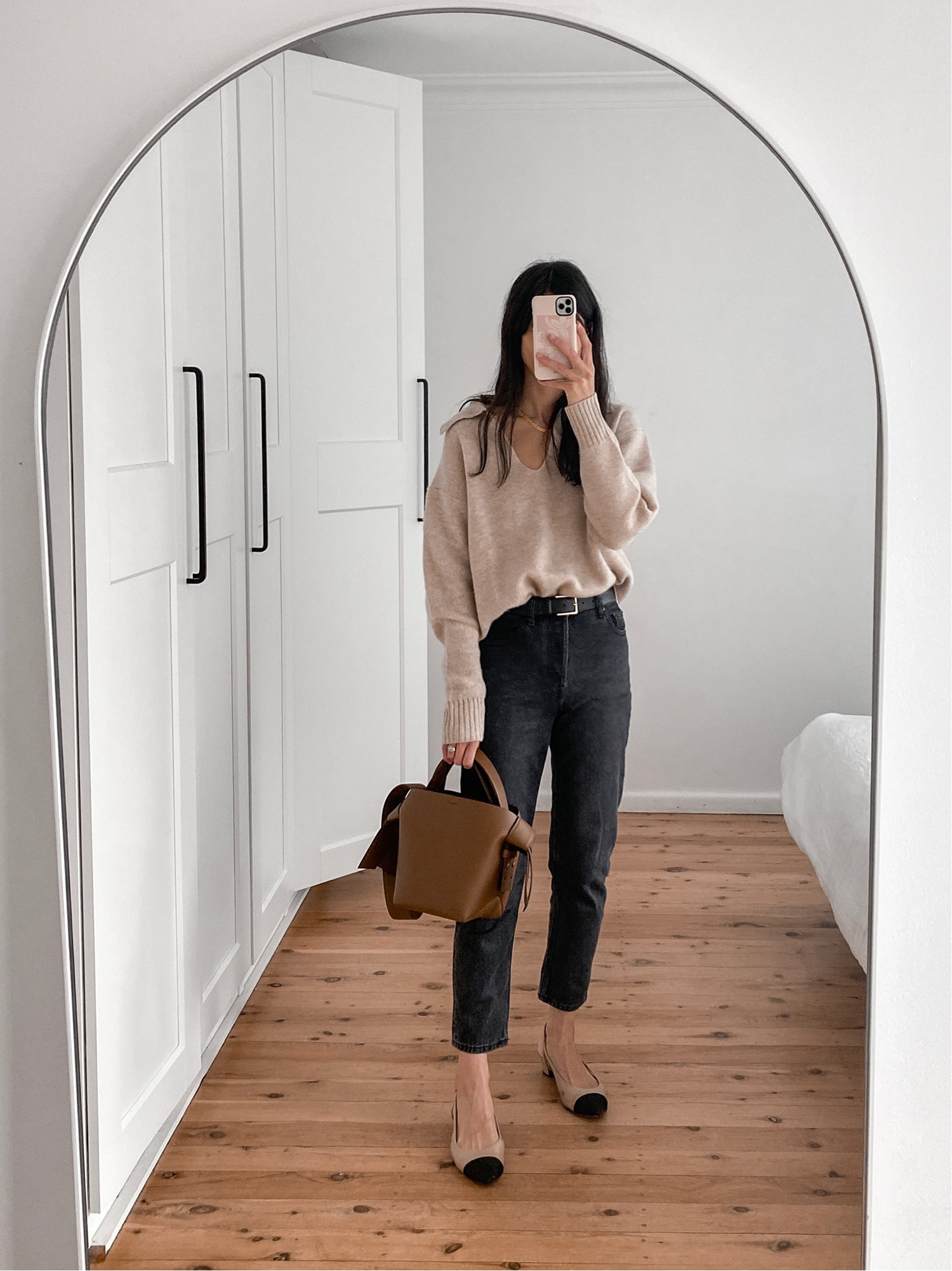 Wearing Venroy cashmere sweater with Everlane 90s cheeky jeans and two tone pumps
