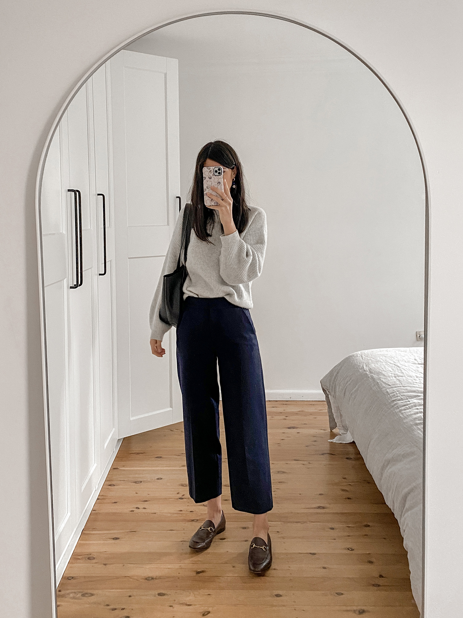 COS navy wool trousers and Gucci loafers