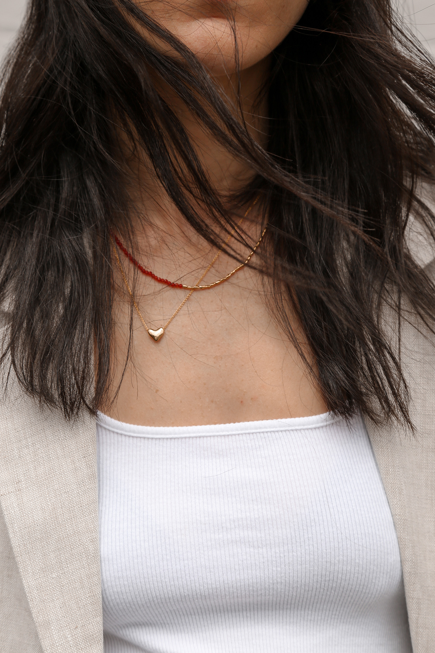 Monica Vinader red beaded necklace and gold heart necklace