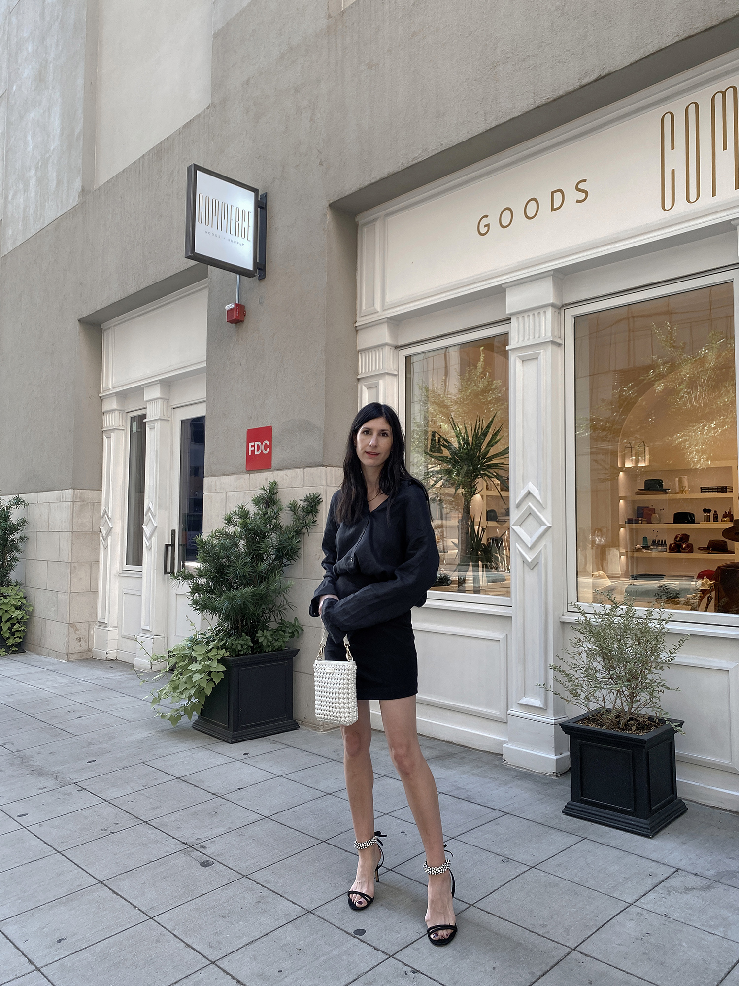 All black outfit wearing linen shirt with mini skirt