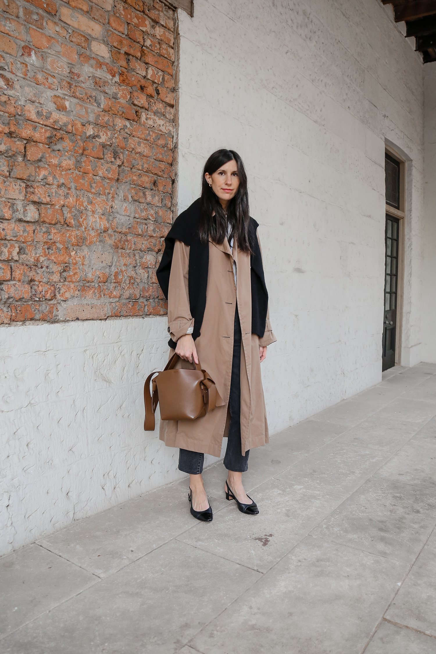 Scandi streetstyle minimal outfit wearing trench and Toteme jeans