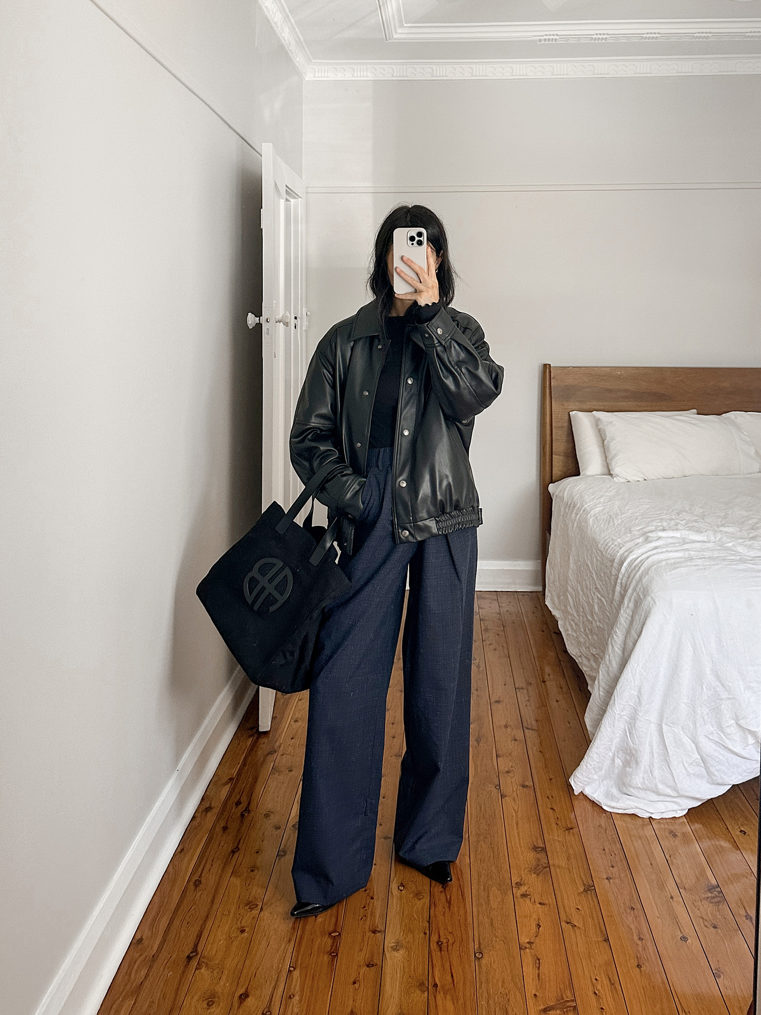 Wearing Tibi Stella pants with TheOpen Product faux leather bomber jacket