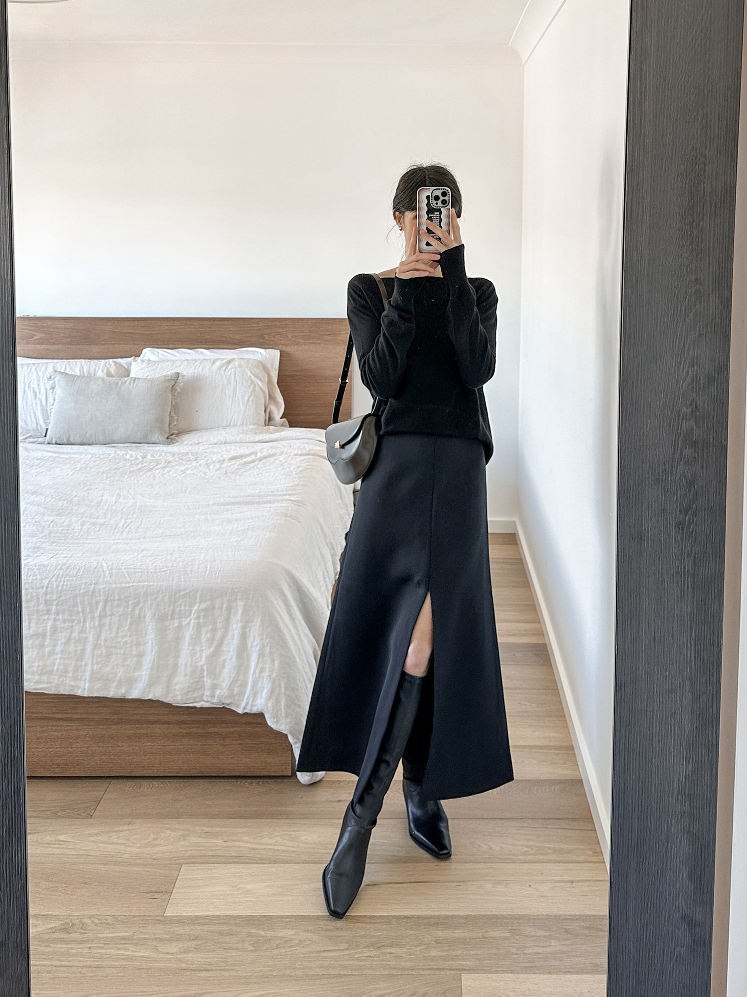 All black outfit wearing MAJR Label split skirt and Arket leather boots