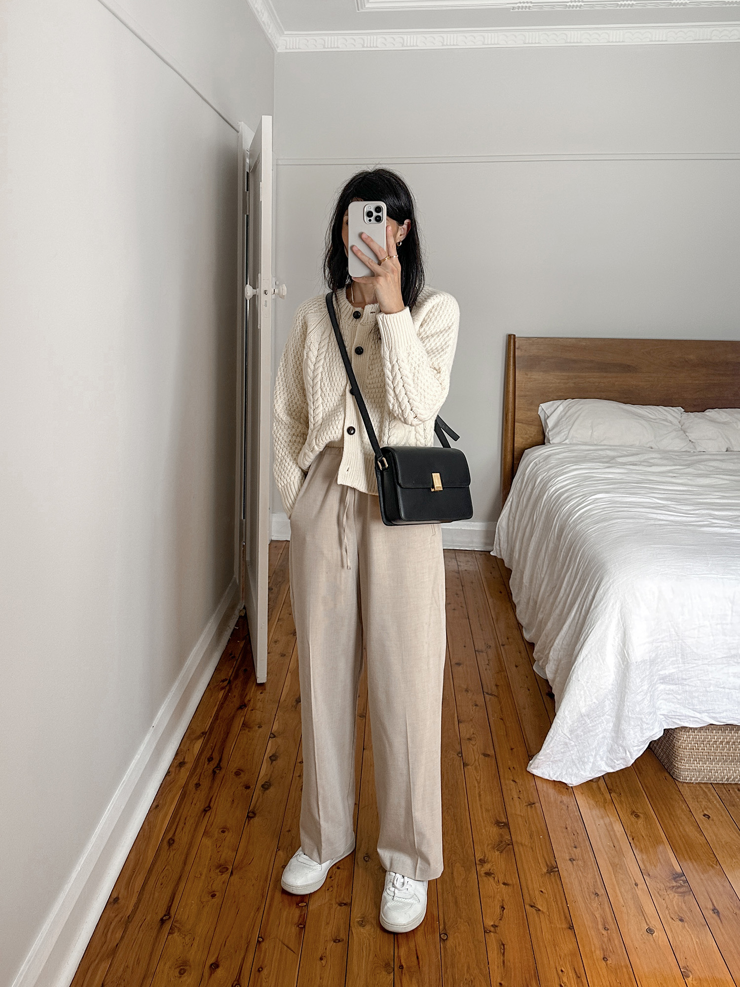 Minimal beige neutral toned outfit for winter wearing Veja V-10 sneakers