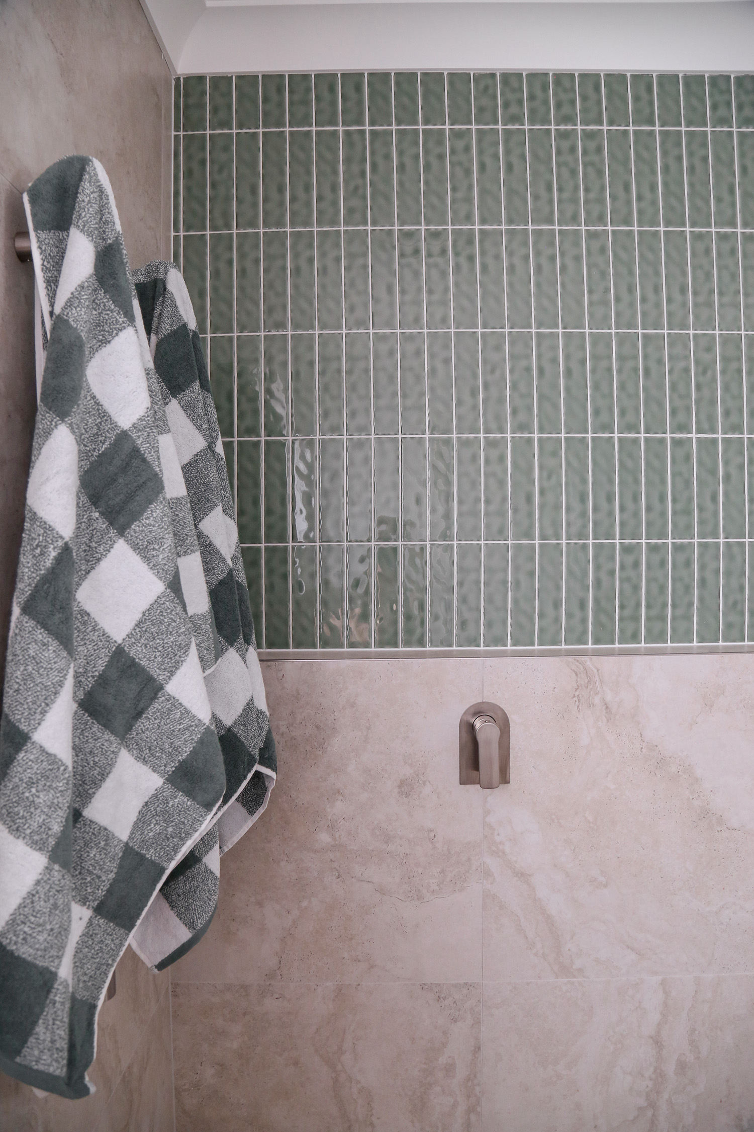 Japandi style ensuite bathroom green tiles minimal calming