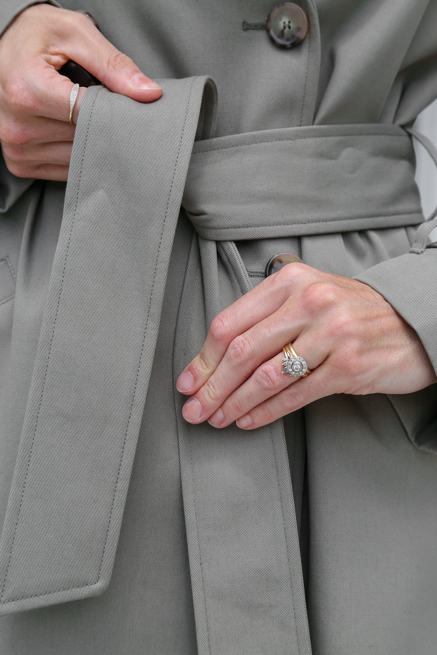 Tying belt on coat