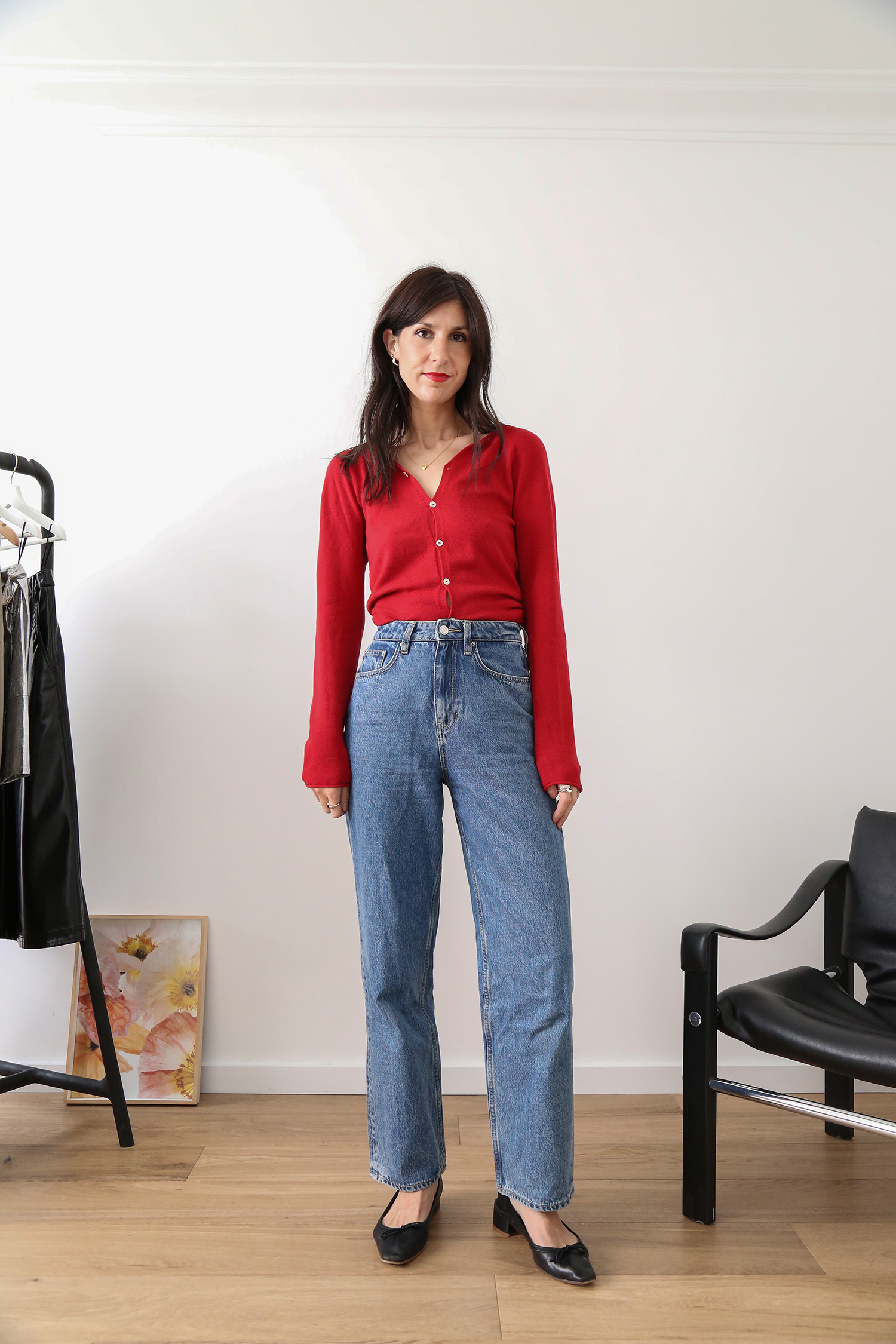 Red knitwear with straight leg blue jeans