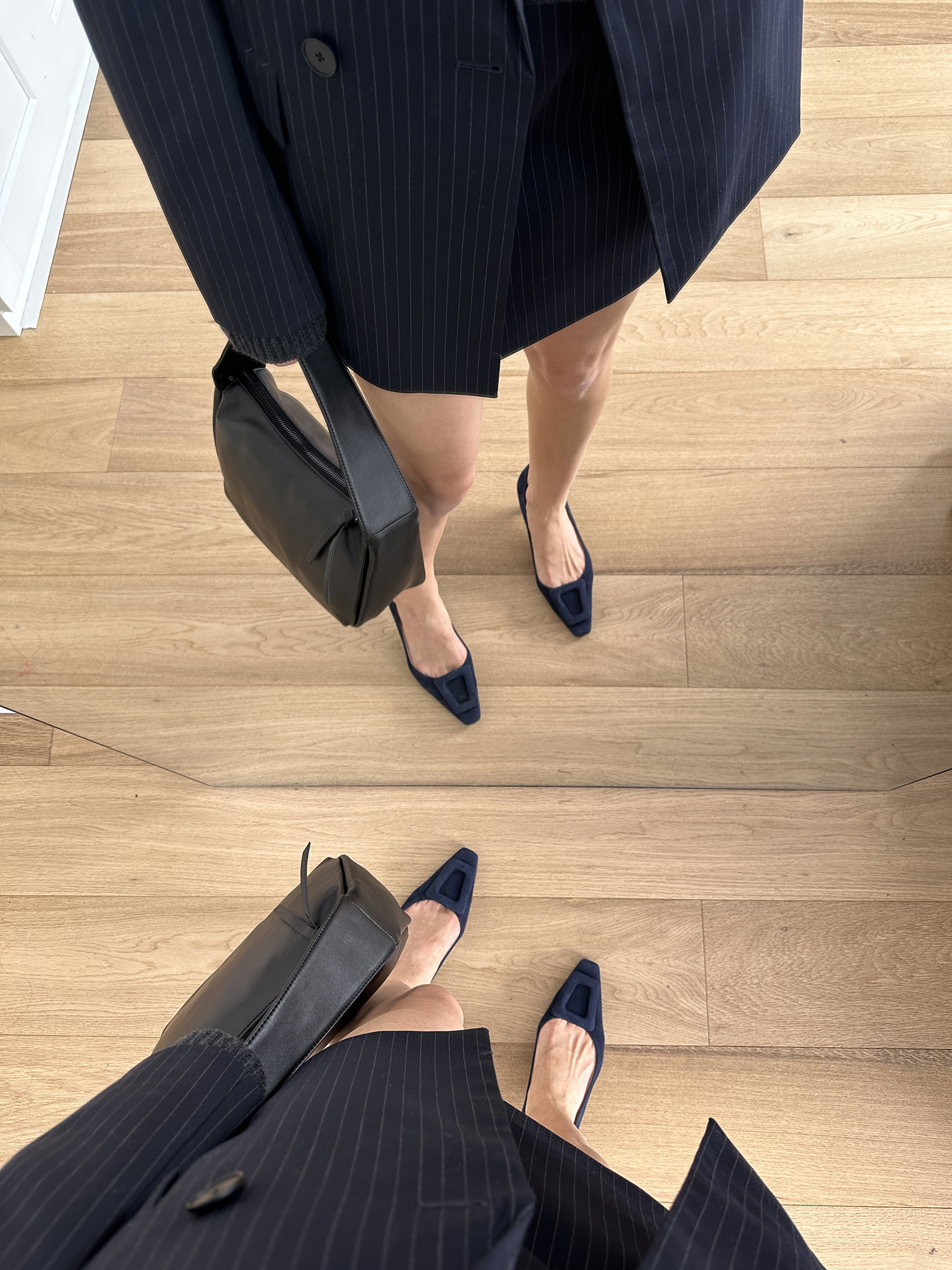 Mirror selfie wearing Edward Meller Astra60 Pumps in Navy Suede