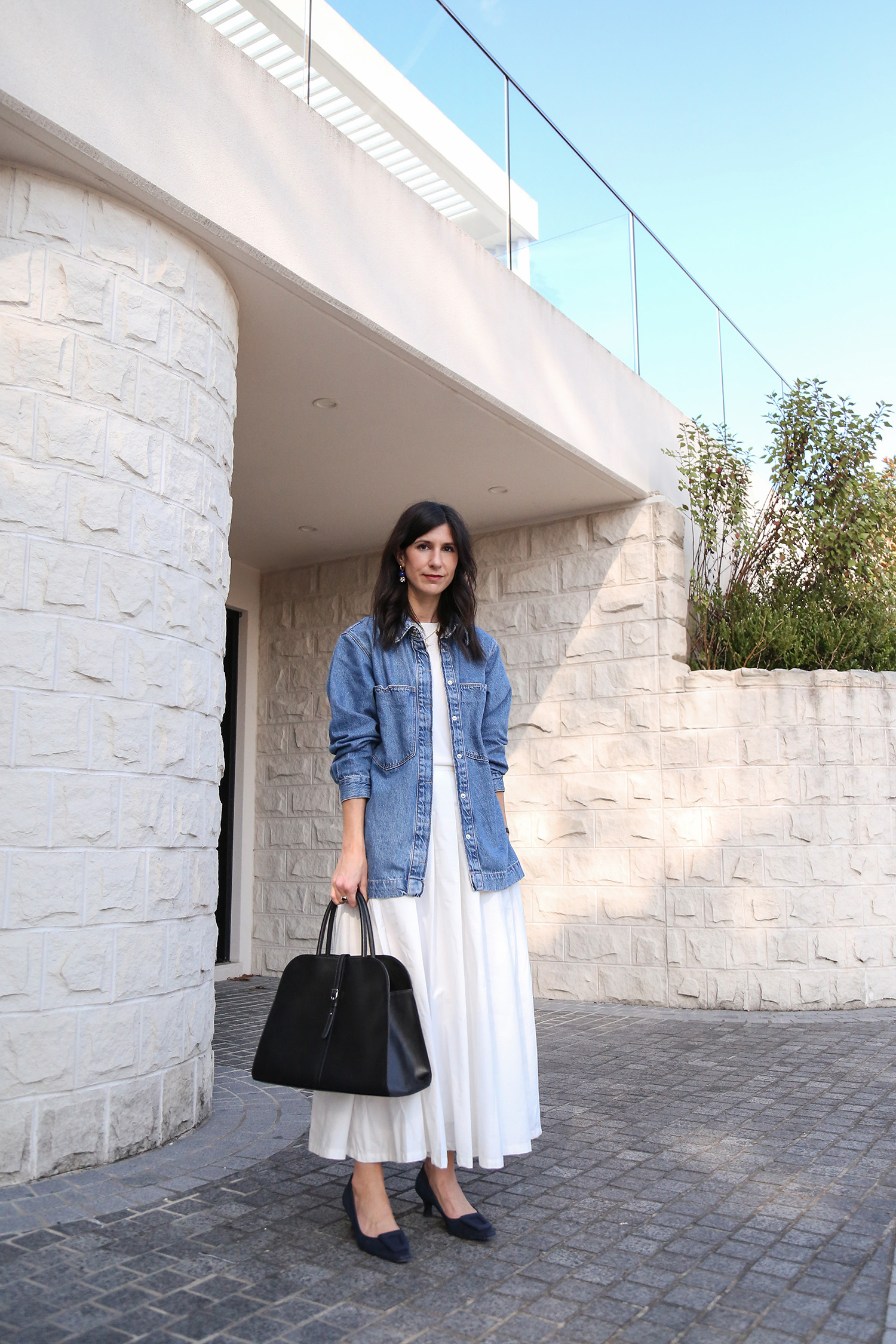 Ladylike outfit with white full skirt and denim shacket with dupe for The Row Margaux tote