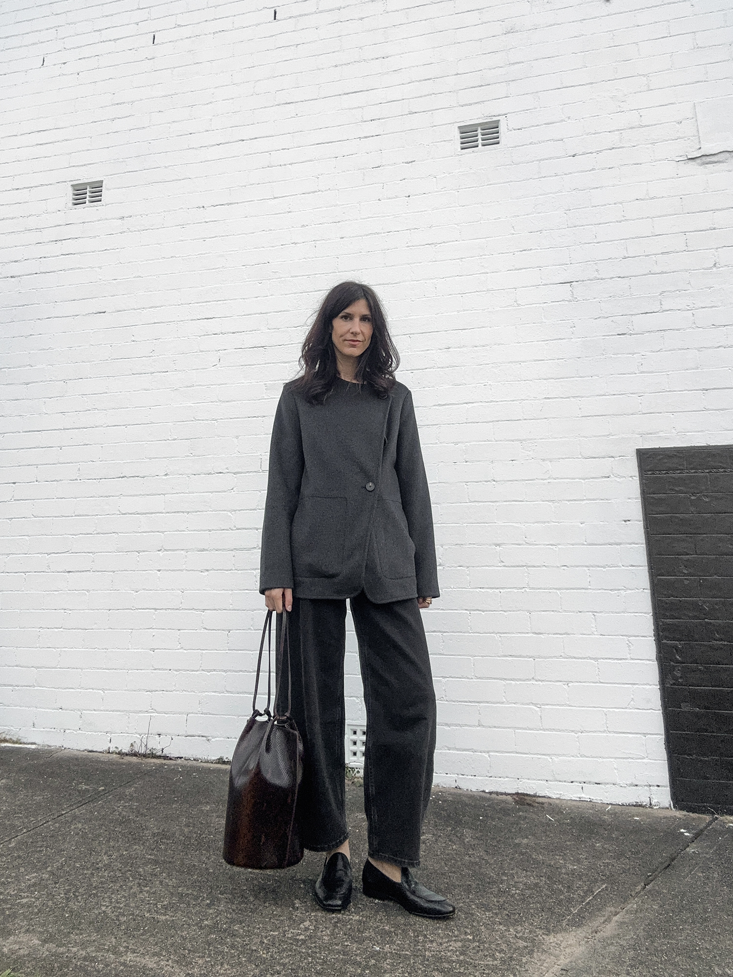 Minimal Style outfit with short wool jacket and barrel leg jeans