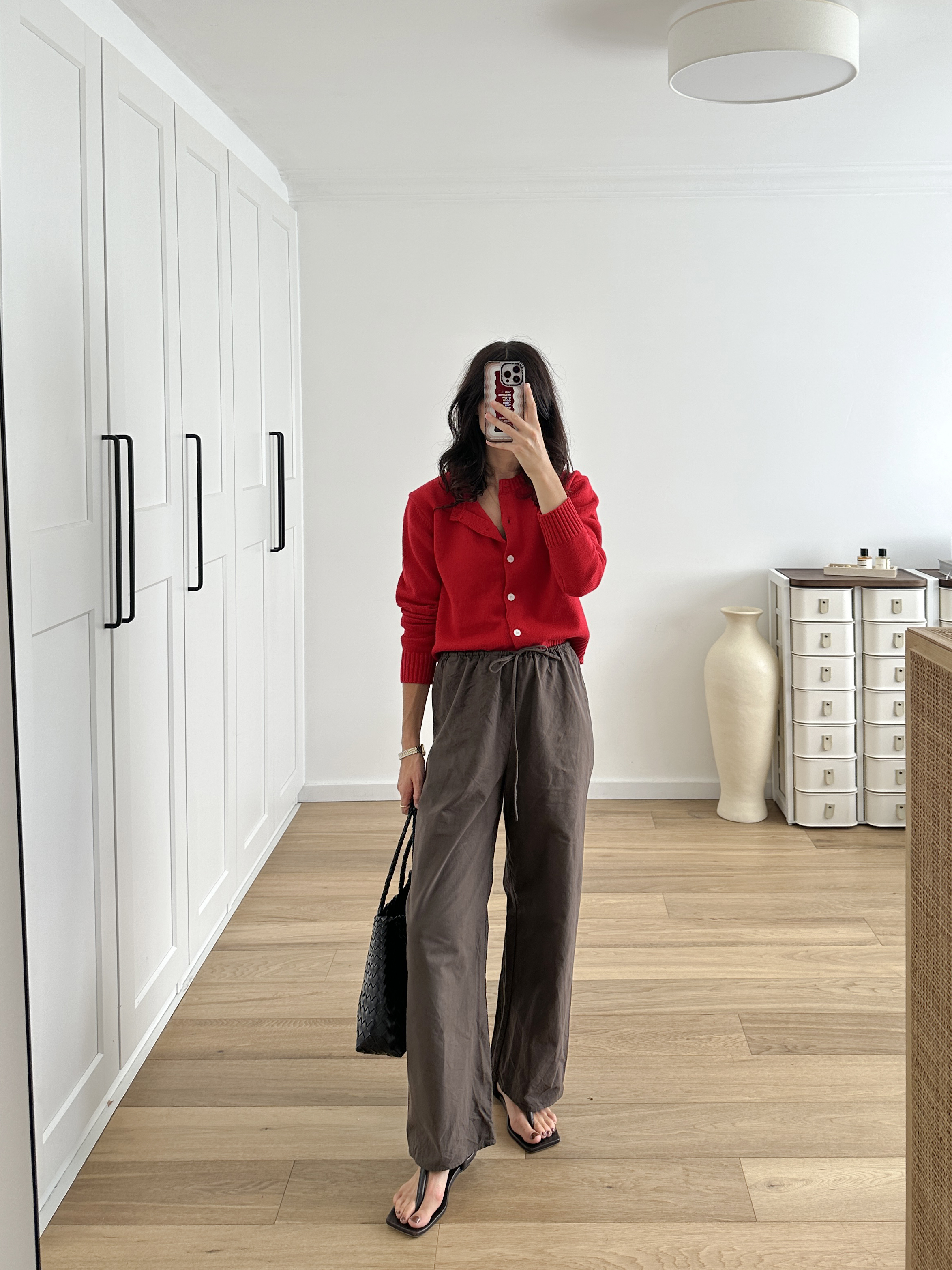 styling a red cardigan with unexpected neutrals