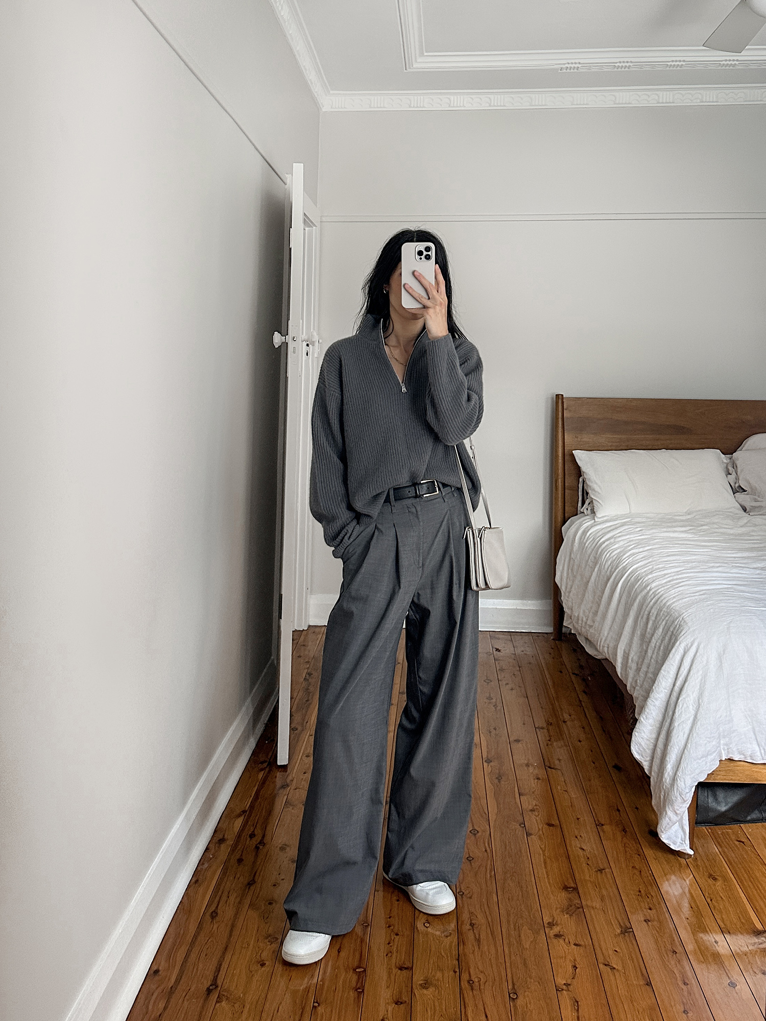 wearing Jenni Kayne half zip and Gentle Herd fluid drape trousers