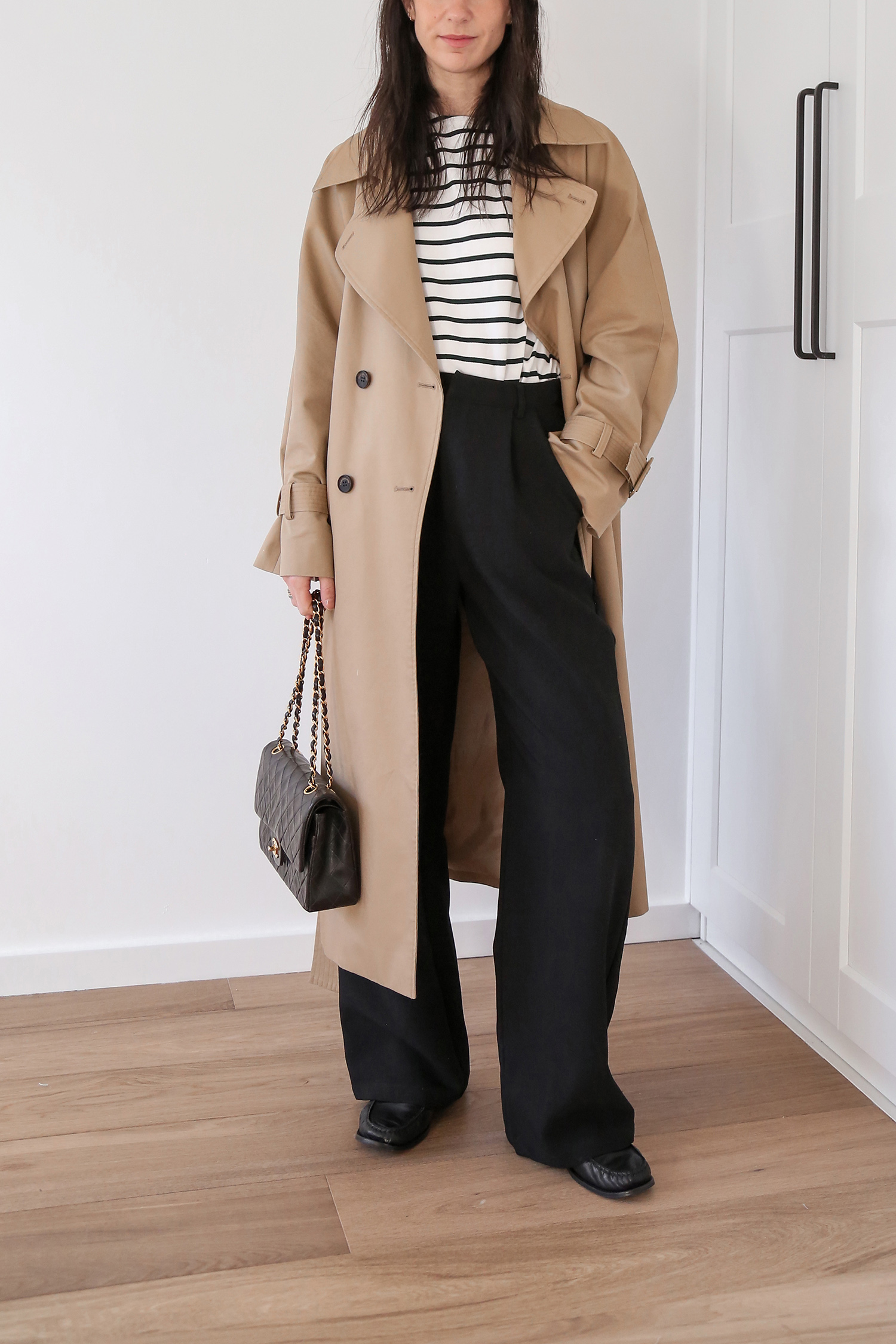Classic Parisian chic style with stripe top and DISSH black rowan pants