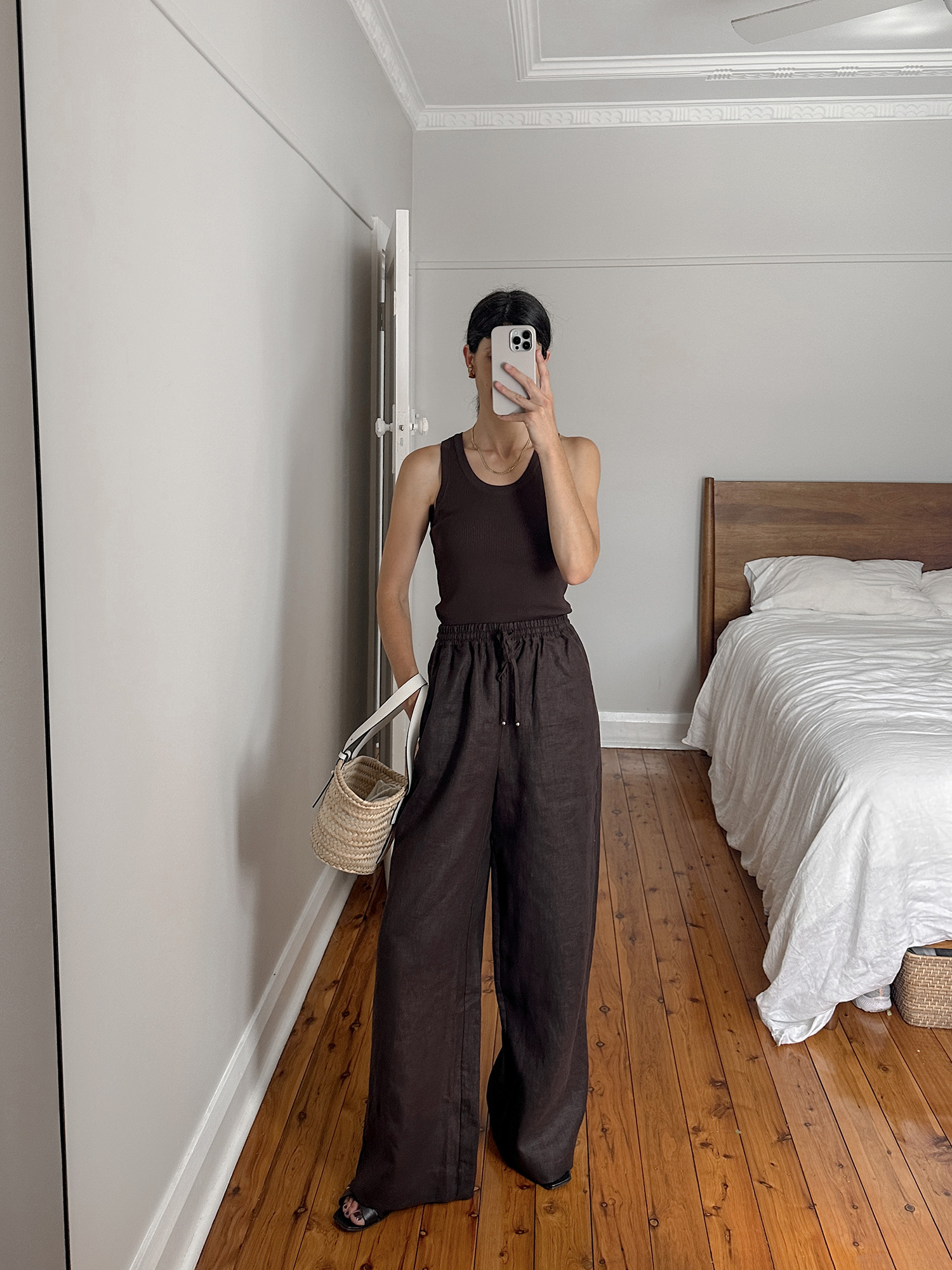 Wearing monochrome chocolate brown ONTE ribbed tank with Sunset Lover linen trousers