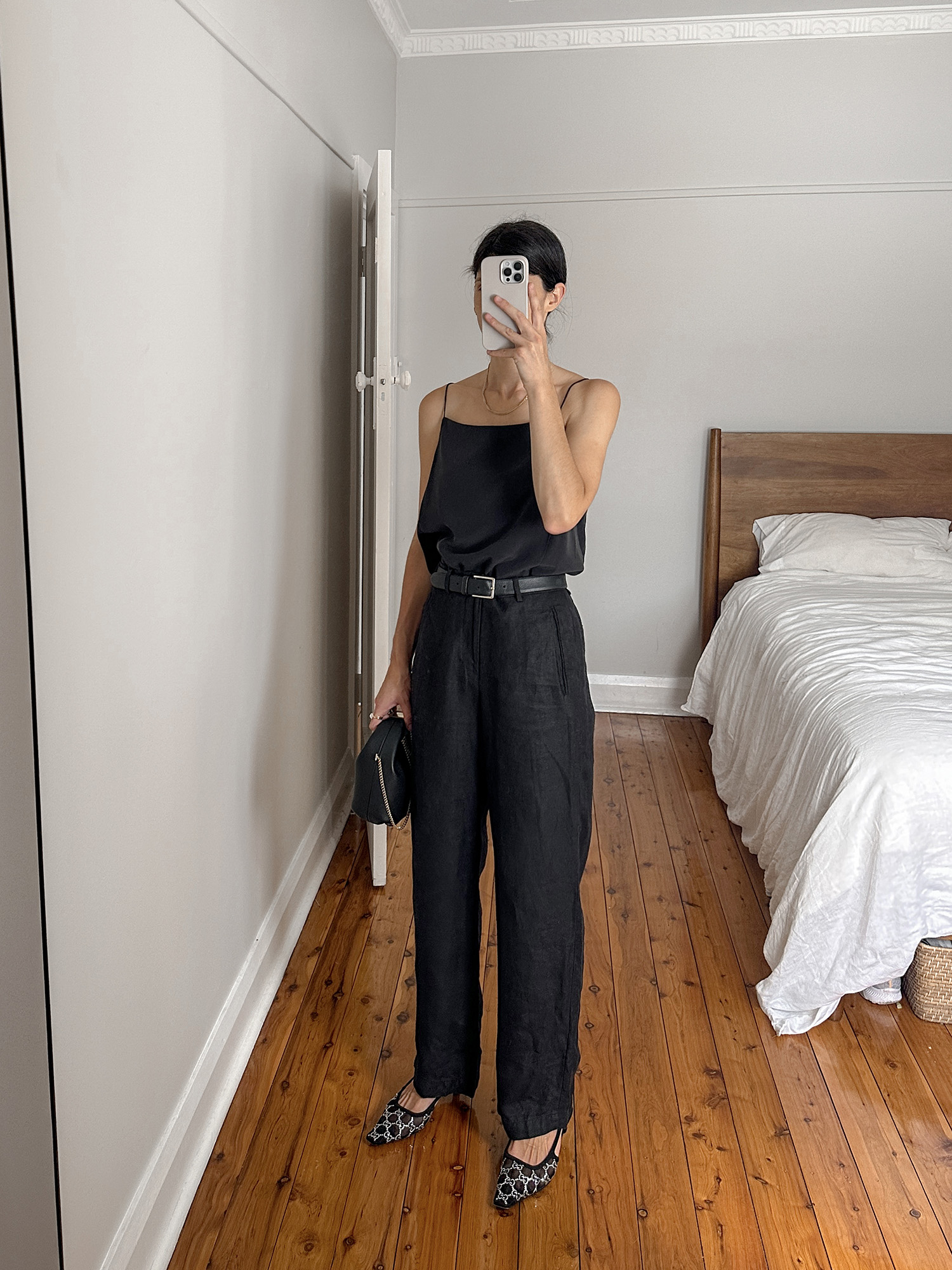 Minimal all black outfit with Grana silk cami and Facade Pattern trousers